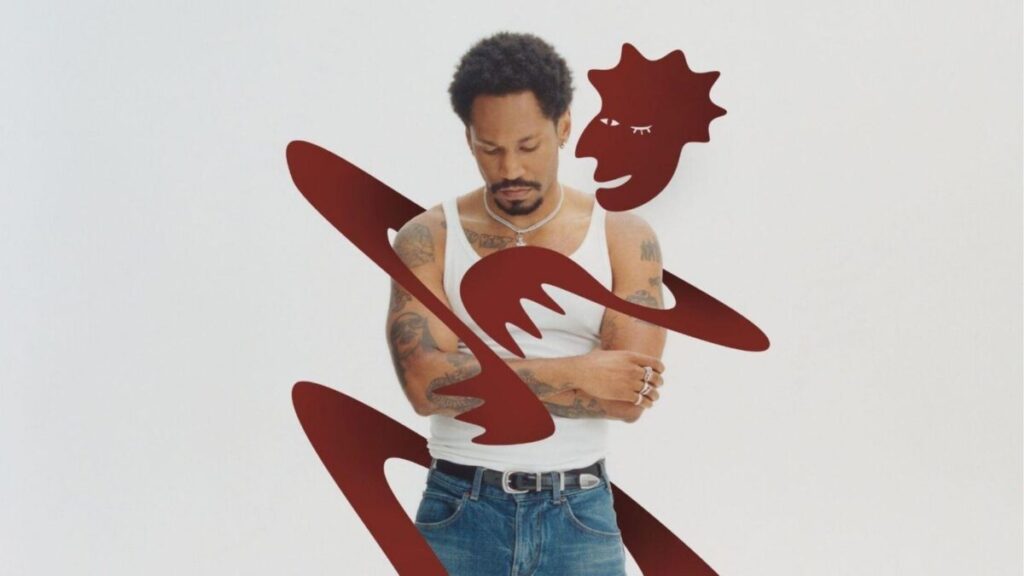 KAYTRANADA se apresentando ao vivo em show, com público animado e luzes coloridas